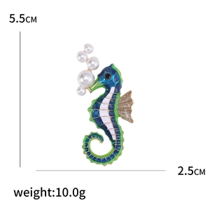 Creative enamel seahorse brooch in blue and green with dimensions 5.5cm by 2.5cm