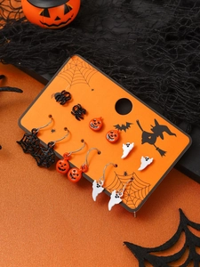 Halloween earring set with pumpkin, ghost, and spider web on festive display card