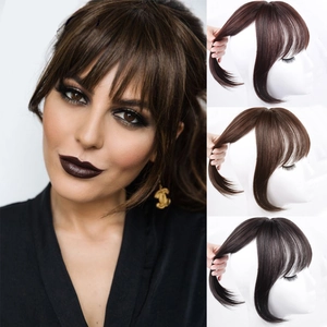 Close-up of clip-in 3D air bangs in black, dark brown, and light brown synthetic hair