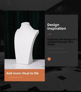 Minimalist white matte necklace display bust on marble surface for jewelry showroom