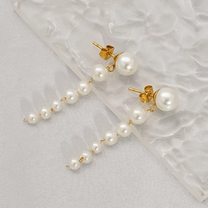 Elegant 18k gold plated pearl tassel drop earrings with S925 silver studs on white silk