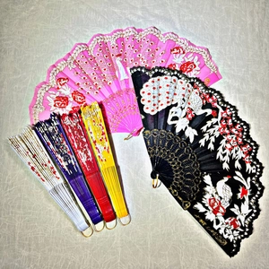 Detailed view of colorful folding fans with sequins, lace, and peacock floral patterns