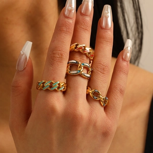 Four-piece gold stainless steel rings set with bohemian enamel charms and evil eye details