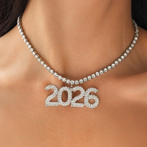 Close-up of sparkling 2026 crystal pendant on a silver-plated tennis chain necklace
