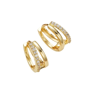 Golden double layer geometric hoop earrings with sparkling rhinestones on white background