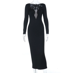 Close-up of sparkling sequin trim on deep V-neckline of elegant black mermaid evening dress