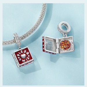 Macro view of S925 sterling silver pizza charm with red enamel and hinged lid