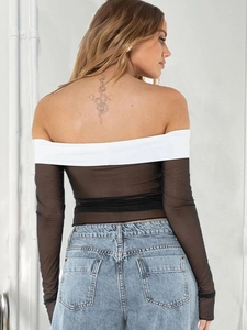 Back view of a black and white off-shoulder mesh long sleeve top with slim fit silhouette