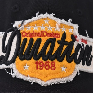 Cotton baseball cap with yellow shield patch and vintage Duration 1968 embroidery
