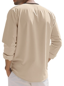 Rear view of men's casual beige long-sleeve Henley shirt showing fabric fit and texture