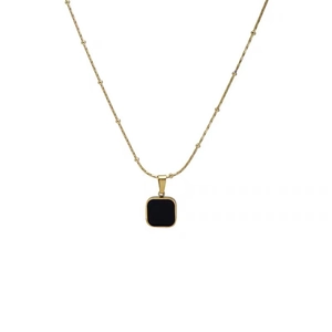 Elegant gold beaded chain necklace featuring a minimalist black square pendant in 45-degree view