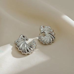 Silver swirl shell earrings in premium copper with gold plating for a vintage luxury look