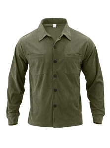 Detail of olive green corduroy shirt showing vertical ribbed texture and front chest pockets
