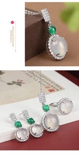 Detailed close-up of translucent white chalcedony jewelry set with green bead accents