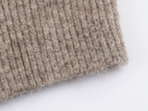 Macro shot of oatmeal ribbed knit fabric with soft brushed wool texture and details