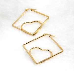 Golden 18K stainless steel square frame earrings with heart pattern on plush background