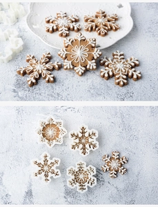 Detail showing various snowflake cookie molds and finished snowflake-shaped pastries