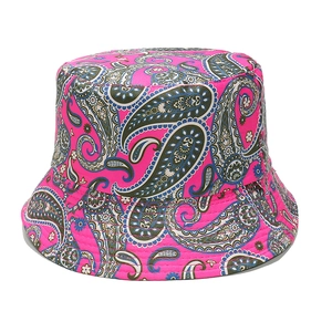 Close-up of pink bucket hat featuring vibrant paisley print and detailed canvas stitching