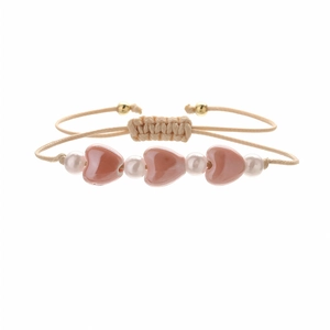 Bracelet tressé fait main avec cœurs en céramique rose et perles sur cordon kaki