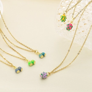 Pastel fruit pendant necklaces featuring 3D dragon fruit and berry charms on gold chains