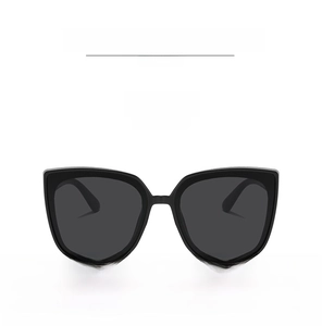 Front view of trendy oversized square sunglasses with black frames and grey lenses