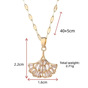 Detailed view of golden ginkgo leaf pendant necklace with dimensions 2.2cm x 1.6cm