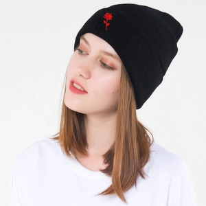 Women black knit beanie featuring a red rose embroidery for autumn and winter warmth