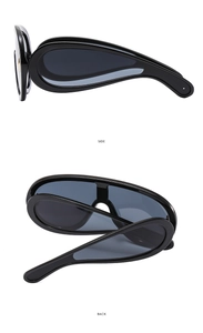 Side and back view of black oversized sports sunglasses with unique curved drop-shaped temples