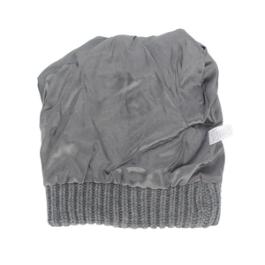 Detail of dark grey knit beanie showing anti-static satin lining and product care label