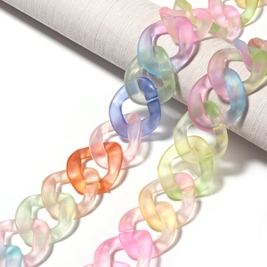 Macro detail of frosted macaron gradient acrylic chain links for DIY accessory making