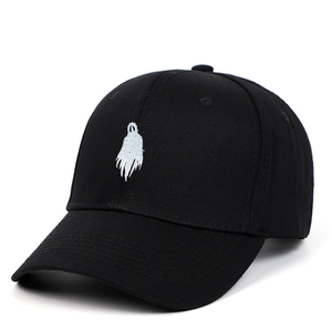 Black cotton baseball cap with white ghost embroidery shown at a 45-degree angle