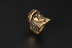 Macro side view of retro golden Jesus portrait ring with vintage carved textures