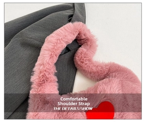 Detail showing plush pink shoulder strap with red heart pattern and soft faux fur texture