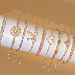 Gold plated bracelet collection with cubic zirconia charms and heart pendants