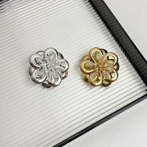 Vintage metal camellia brooch in gold and silver finish with hollow woven design