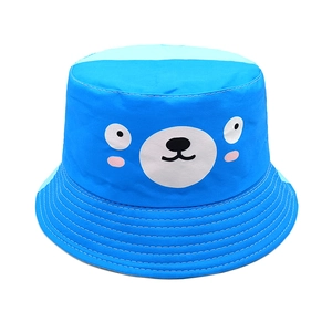 Detail of blue cotton sun hat for kids featuring a cute white cartoon bear face print