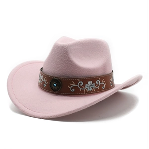 Detail of pink felt cowboy hat with embroidered floral band and turquoise stud
