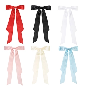 Long satin ribbon bow hair clips set for girls in six vibrant colors on white background