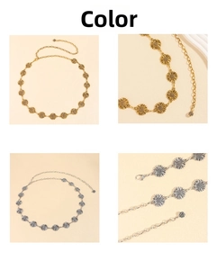 Detail of sunflower link metal waist chain in gold and silver with rose pendant
