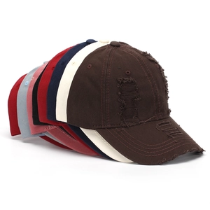 Distressed cotton baseball caps stacked in multiple colors showing retro washed details