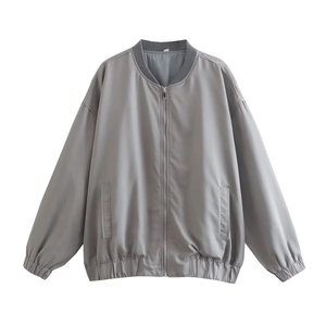 Detailed flat lay of a grey bomber jacket with zipper closure and ribbed collar design
