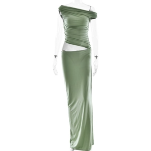 Detail of green ruched dress featuring one-shoulder neckline and waist cutout design