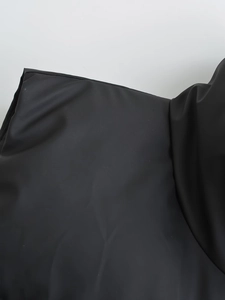 Detail of black stand collar vest showing matte windproof fabric and precise stitching