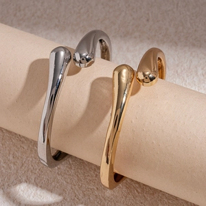 Minimalist irregular waterdrop open cuffs in polished gold and silver finishes