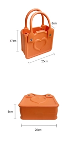 Detailed view of an orange EVA beach bag with heart relief pattern and dimensions