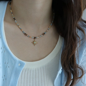 Bohemian beaded necklace with tiger eye stones and a golden star pendant for women