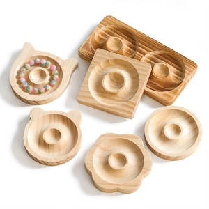 Macro shot of various shaped wooden jewelry trays showing natural grain textures