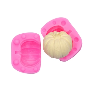 Pink silicone mold for pumpkin shaped cake decoration with white pumpkin sample
