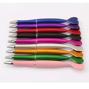 Detailed top view of ten multi-colored heart-shaped pens arranged on white background