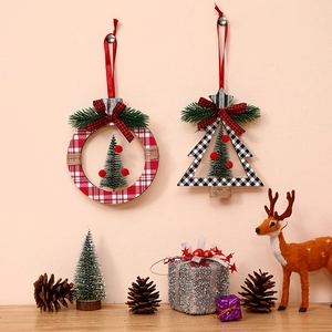 Plaid cedar tree and round wooden Christmas ornaments hanging in a festive holiday scene